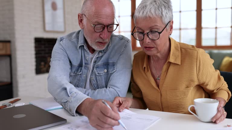 Senior couple doing financial planning at home